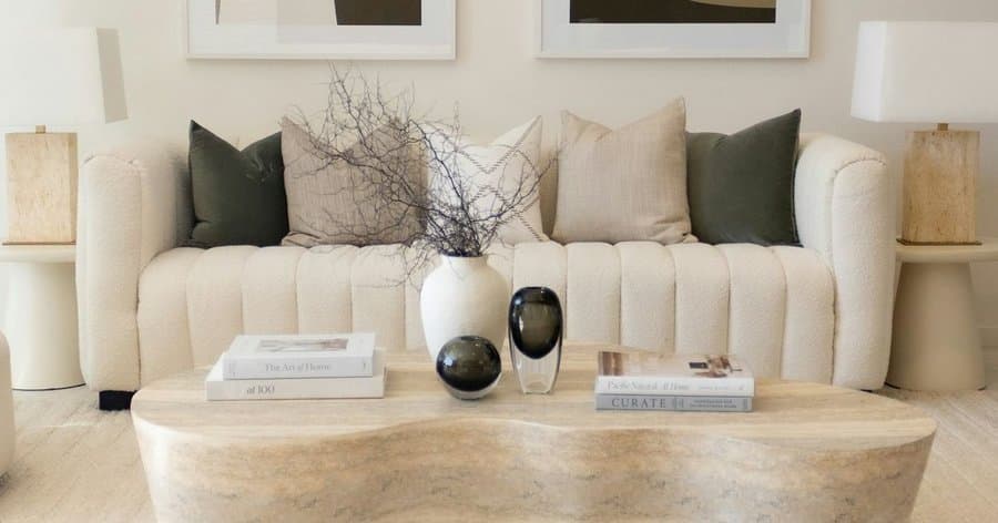 The Marchetti Sofa in cream bouclé, channel-tufted back cushions.
